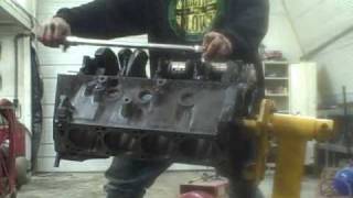 Engine Assembly Part 3 torquing main cap bolts [upl. by Solrak]